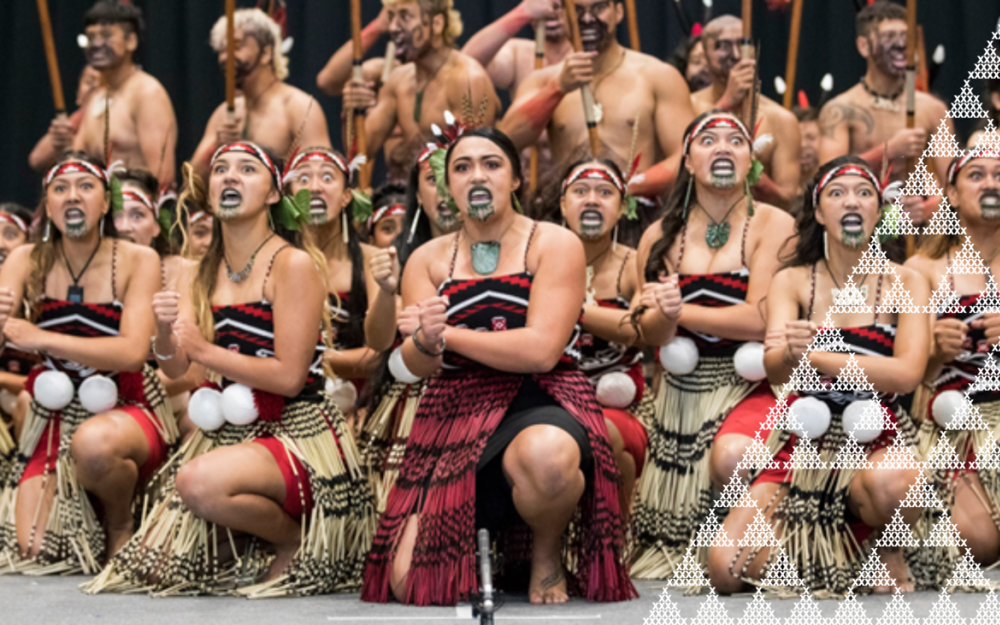 A group of performers perform Haka on stage