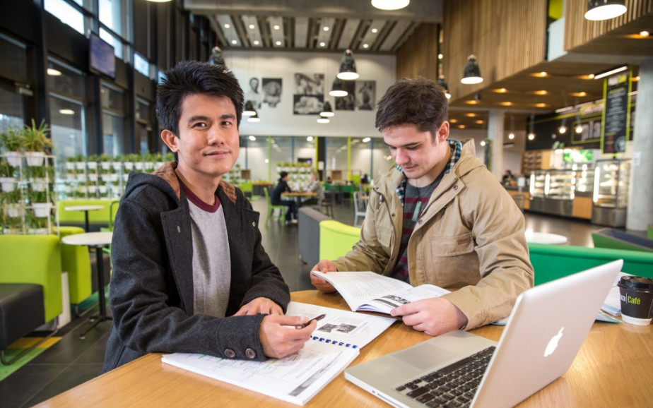 Two men study in a student library
