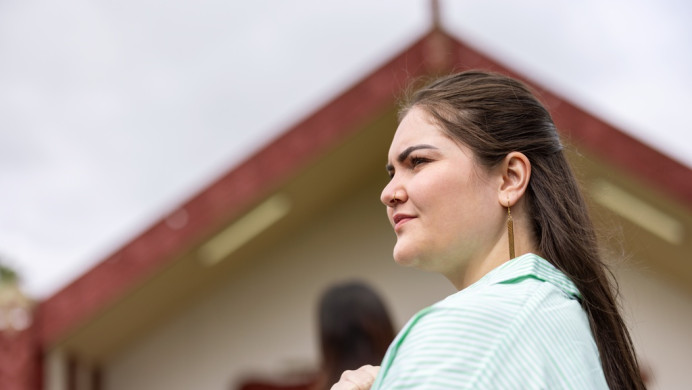 Image shows a marae and a wahine woman, representing NCEA Health Studies