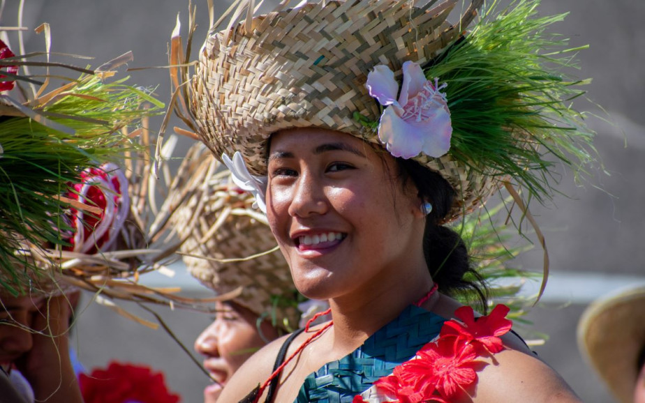 A performer smiles at the camera
