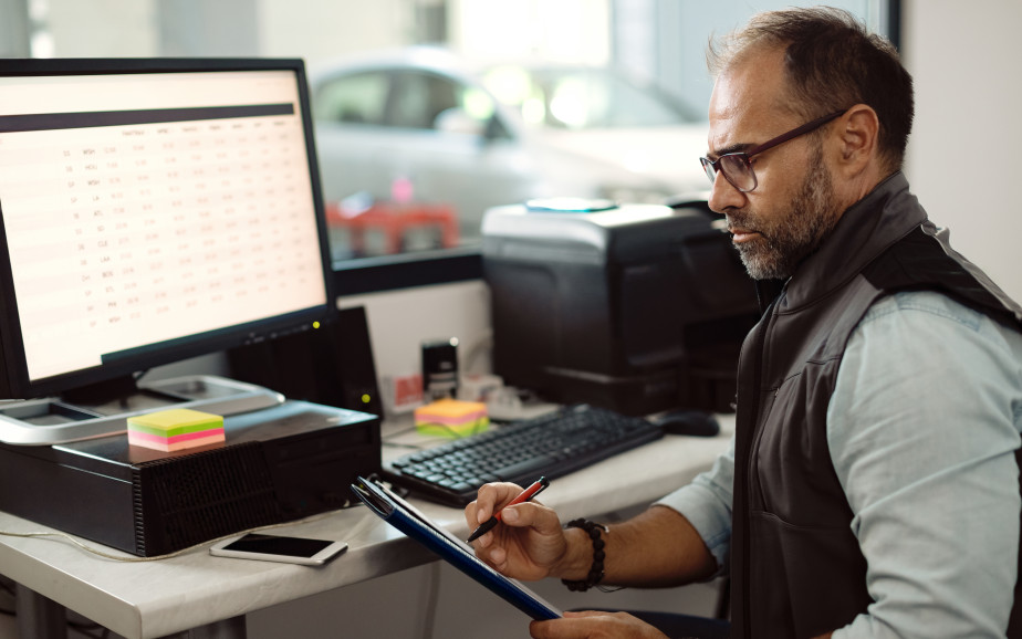 An administrator sits at his computer to make a statutory declaration