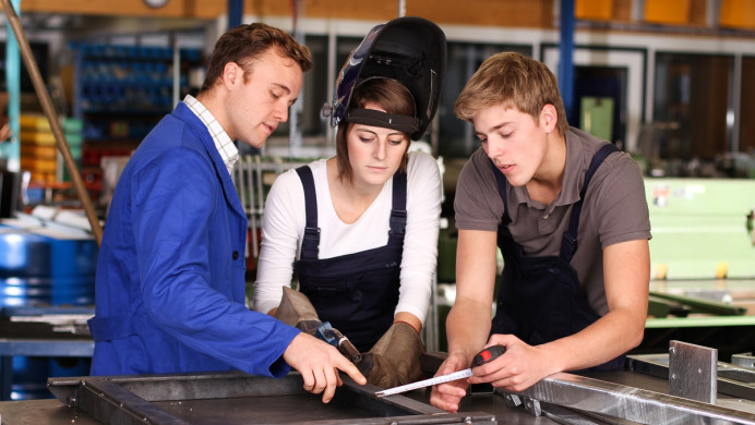 Tutor with welding students
