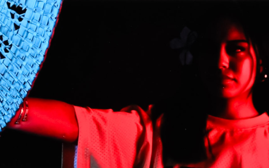 A photo of a person in shades of pink and blue, part of this year's Top Art tour